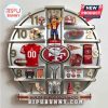 A silver wall clock with San Francisco 49ers themed images and logos as hour markers.!