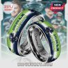 Two stainless steel rings, Super Bowl LX Champions Seattle Seahawks, team helmet. Inscription: Emerald City.!