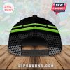 Back view of a black cap with green stripes and a polka dot pattern.!