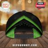 Back view of a black cap with green chevron stripe and small star pattern.!
