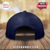 Rear view of a dark blue, perforated baseball cap with an adjustable strap.!