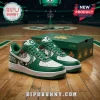 Green and white Boston Celtics custom sneakers, featuring a leprechaun playing basketball, shamrocks,