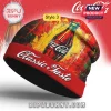 Red beanie with Coca-Cola bottle, painted effect, and text: Classic Taste!