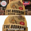 Beige beanie with Jim Beam Bourbon design. Reads: 'THE BOURBON SINCE 1795'. Features bottle graphic and 'CUSTOM NAME' tag!