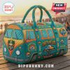 Blue and orange quilted duffel bag with surfing and beach-themed patches. Words include Dirty Heads, Sound of Change, Swim Team.!