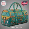 Turquoise duffel bag with a VW bus design and beach/surf themed patches. Features palm trees, skulls, and waves.!