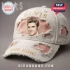 White hat: Elvis, The King. Ripped denim, beige text, portrait graphic, pink accents. Music fan merch!