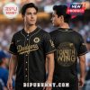 Black baseball jersey with gold accents. Features 'Dodgers' text, 'Fourth Wing' graphic. Sport this style!