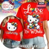 Red tee with Hello Kitty, puzzle-piece bow & ribbon; text: Love Needs No Words!
