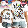 White tee, Hello Kitty wearing puzzle piece bow/ribbon. Text: Love Needs No Words. Cute Autism Awareness design!