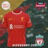 Red Liverpool Football Club jersey with yellow vertical lines, logos, and sponsors.!