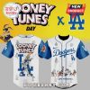 Looney Tunes Dodgers jersey! White/blue, cartoon style. Features Bugs, Daffy, Tweety, & text: 'Looney Tunes Day' 'Dodgers' 'Los Angeles'.!