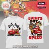 White tees feature cartoon race car and Mickey Mouse. Text: TWO LEGENDS. ONE TRACK, LIGHTS OUT FULL SPEED.!