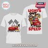 White tee, cartoon style, Mickey Mouse, Lightning McQueen, Mater. Text: TWO LEGENDS. ONE TRACK! LIGHTS OUT! FULL SPEED!