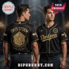 Black Dodgers jersey with gold 'Onyx Storm' dragon design. 'Brave The Dark' text. Cool baseball fan apparel!