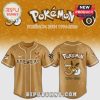 Front and back view of a gold baseball jersey with Pokemon and Brewers text and graphics.!