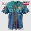 A light blue Giants baseball jersey with Pokemon characters and lightning bolts pattern.!