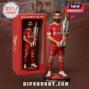 Mohamed Salah figurine in Liverpool kit holding a trophy, displayed inside and outside a red box.!