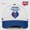 White baseball cap with blue brim, text 'National Love Your Pet Day,' paw prints, and a blue heart with a red 'T' inside.!