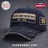 Navy blue hat featuring 'Notre Dame Fighting Irish 1887-2026' in gold text, distressed vintage style!