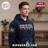Navy blue hoodie, Notre Dame Fighting Irish, 1887-2026 text, cartoon character. College sports apparel!