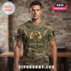Camo tee with Scooby-Doo in military garb! Reads 'SCOOBY-DOO' in a star-winged emblem; US flag patch on sleeve!