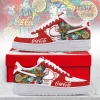 Red and white custom sneakers feature vibrant pop art Coca-Cola design with bottles, lemons, ice cubes. Bold 'Coca-Cola' text!