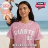 A pink baseball jersey with white trim, featuring the text 'GIANTS' and the number '00' in white on the front!