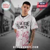 White baseball jersey with pink trim and black text 'SUICIDE BOYS' with pink praying skeleton and skull graphics!