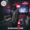 Man in a dark grey pullover hoodie with a graphic text design on the chest standing in a neon-lit urban alley at night!
