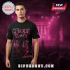 A black t-shirt with pink graphics of skulls and a skeleton! Text says 