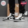Black and white custom athletic high-top sneakers, streetwear style, featuring 'NIKE AIR', a star, 'Custom None' text, and a signature scribble design!