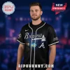 Black Luke Combs Braves baseball jersey with white script text, tomahawk logo, and 'Saturday Nights' neon sign design!