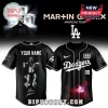 Custom black Martin Garrix Dodgers baseball jersey with Americas Tour LA logo and red galaxy graphic on front and YOUR NAME on back!