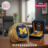 Gold Michigan Wolverines men's basketball championship ring with blue gem, yellow 'M' logo, and small yellow stones!