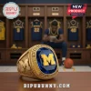 Gold collegiate championship ring featuring a large blue faceted stone, bold gold 'M' emblem, 'MICHIGAN WOLVERINES' text, and 'men's basketball' lettering!