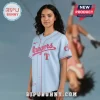 Light blue baseball jersey with red piping and script text 'Rangers' across the chest with a red 'T' logo below!