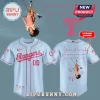 Light blue and pink Rangers baseball jersey with text 'you seem pretty sad for a girl so in love' on the back for customization!