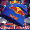 Blue knit beanie with embroidered red bulls on yellow circle, plus 