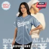 Light blue baseball jersey with white Dodgers script text, LA logo, and a peace sign baseball graphic on the sleeve.!