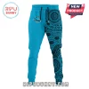 Split-leg joggers in cyan blue! One solid leg with a shark logo, one leg with a black indigenous dot art pattern!