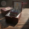 Dark brown wood box with gold Star Trek 60th Anniversary glass, features USS Enterprise, phaser, nebula colors and 1966-2026 text!