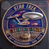 Gold Star Trek 60th Anniversary coin with blue border, silver Enterprise, deep space background, and bridge controls! Reads 