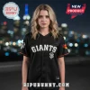 Black GIANTS baseball jersey with white SF logo and orange sleeve trim worn by a woman!