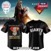 Black SF Giants baseball jersey with Supergirl and a white dog on the back with the text WATCH OUT UNIVERSE!