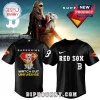 Black Red Sox baseball jersey with Supergirl and white dog on back with text WATCH OUT UNIVERSE and Superman shield logo!