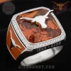 Silver longhorn ring with faceted orange gem, clear stone halo, orange enamel sides! Engraved 1893-2026! Texas fan gear!