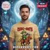 Tan t-shirt with pixel art of Buc-ee's beaver as Link from Zelda on a horse with a sword and text 'BUC-EE'S'!