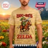 Tan t-shirt with 8-bit pixel art of Buc-ee's beaver as Link from The Legend of Zelda with red text 'Buc-ee's' and 'Zelda'!