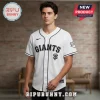 White baseball jersey with black piping and black text reading 'GIANTS' and an 'SF' logo on the chest!